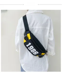 Kids sports chest bag in yellow and black patchwork with 1986 print and buckle strap