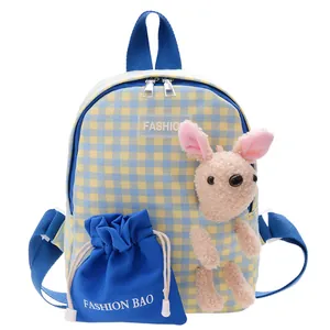Cute yellow and blue gingham kids backpack with plush bunny charm and drawstring pouch