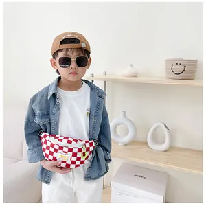 Close-up of red and white checkerboard kids fanny pack with stylish ADDR logo tag