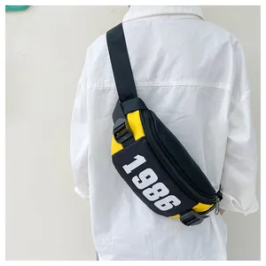 Detail showing the adjustable black strap and sturdy buckle of the yellow sports chest bag