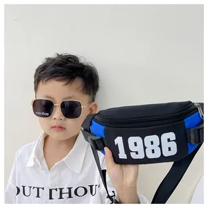Detail of kids chest bag with blue and black color block and 1986 number print