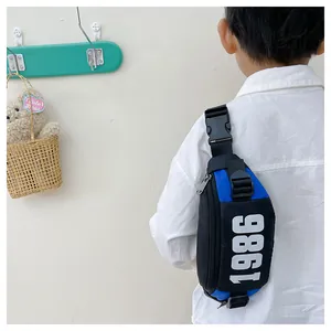 Kids sports chest bag with 1986 logo and adjustable buckle in blue and black finish