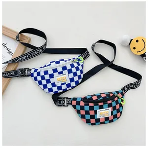 Detail of checkerboard kids chest bag with adjustable lettered strap and zipper closure