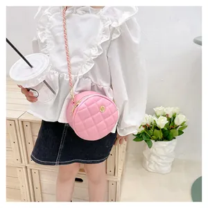 Pink quilted round mini bag for girls featuring a golden rose clasp and chain strap