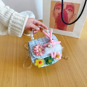 Kids blue tweed crossbody bag with plush rabbit, flower accents and pearl handle