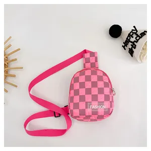 Close-up of pink checkered kids chest bag with adjustable strap and fashion label