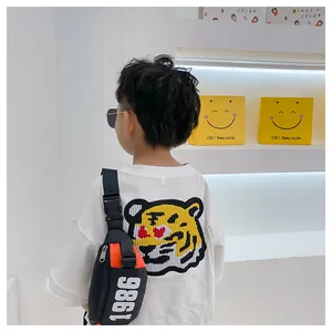 Close-up of children's sports waist bag with 1986 print and cartoon tiger tshirt