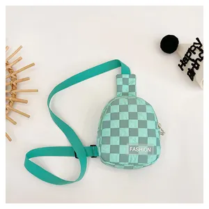 Detail of mint green checkered kids chest bag with Fashion label and adjustable strap