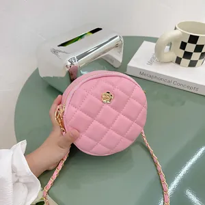 Pink quilted round mini crossbody bag for kids with gold rose metal buckle