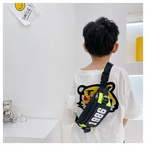Kids' crossbody bag with black and lime green panels and 1986 tiger print detail