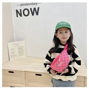 Detail of pink checkerboard waist bag for kids with fashion logo and silver zipper