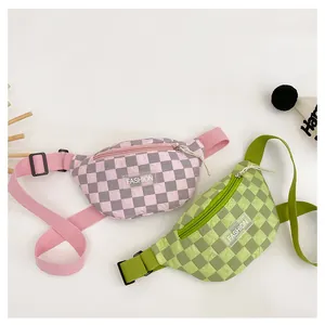 Detail of checkered kids waist bags with fashion labels and adjustable straps