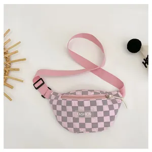 Detail of pink and grey checkerboard kids' chest bag with wrinkled texture and FASHION label