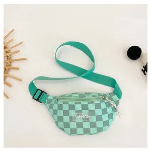 Detail of mint green checkerboard fanny pack with white Fashion text and adjustable strap