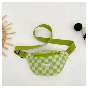 Detail of green checkerboard kids fanny pack with adjustable strap and fashion label