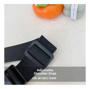 Close-up of adjustable black nylon shoulder strap with a durable plastic buckle