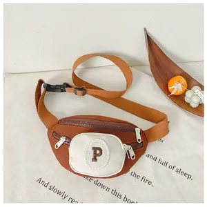 Detail of vintage canvas kids chest bag in earthy red with white zipper pocket and P patch