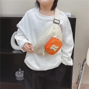 Kids versatile chest bag in beige and orange with R letter patch and adjustable strap