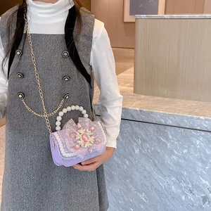 Kids' purple crossbody bag with pearl handle, organza bow and snowflake charm