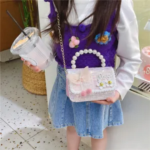 Chic purple sequined kids crossbody bag with pearl handle and bow for stylish girls