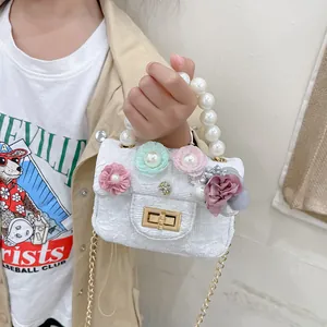 Girls mini crossbody bag with fabric texture, 3D floral accents and pearl handle