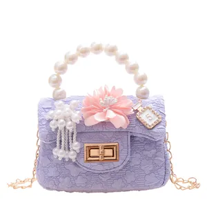 Fashionable purple quilted girls mini bag with pearl handle and flower decor