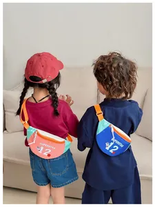 Detailed view of kids crossbody chest bags featuring pink and blue colorblock designs
