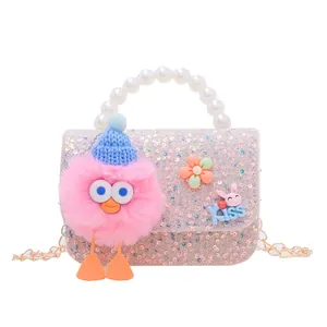 Girls' sequin handbag with pearl handle, plush bird charm, and golden chain strap
