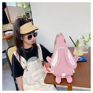 Detailed view of pink rabbit crossbody bag with long ears and Love embroidery on child