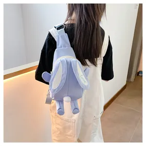 Detail of light blue cartoon bunny crossbody bag with rabbit ears and Love embroidery