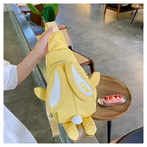 Detail of yellow rabbit crossbody bag featuring 3D ears and Love embroidery for kids