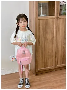 Mini sac à dos rose pour enfant avec poche avant zippée et bretelles réglables à domicile