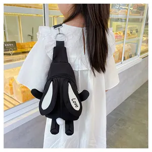 Detail of a black rabbit-shaped kids crossbody bag with white ears and Love lettering