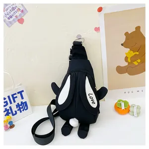 Detail of cute black bunny crossbody bag with long ears and plush ball tail decoration