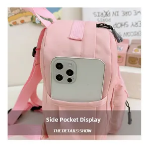 Poche latérale du sac à dos rose pour enfant avec rangement pour téléphone