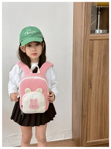 Pink cartoon bunny backpack for toddlers featuring cute 3D ears and a front pocket
