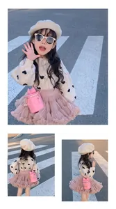 Toddler girl outfit featuring heart knit sweater, pink tutu skirt and bow chain bucket bag