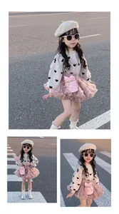 Girl's beige knit sweater with black heart patterns and pink tulle skirt set view
