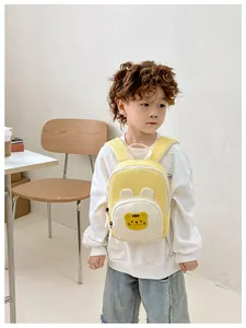 Detail view of mini toddler backpack featuring cute tiger embroidery and 3D ear accents
