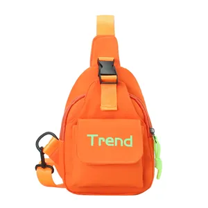 Bright orange crossbody chest bag for kids with Trend lettering and neon zipper pull details