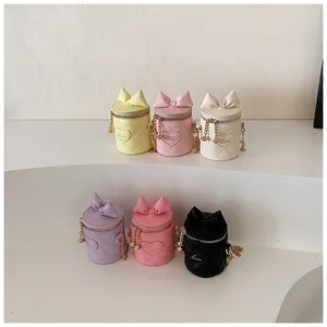 Detailed collection of mini quilted bucket bags with bows and gold chain straps