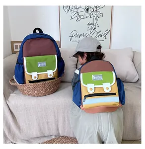 Detailed comparison of two colorful canvas backpacks in small and large sizes for kids