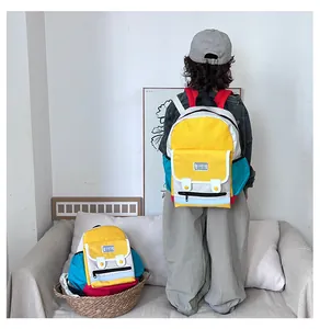 Detail of color-block kids backpack showing various sizes and contrast color shoulder straps