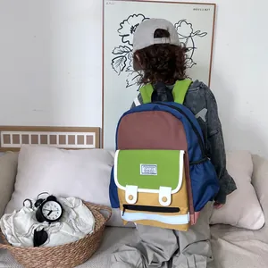 Lightweight canvas kids backpack with colorful patchwork design and wide shoulder straps