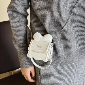 Mini crossbody bag for kids with chic bow and FAVE logo in creamy white finish