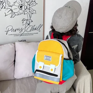Colorful canvas kids backpack with multi-pocket design and vibrant color-blocking panels