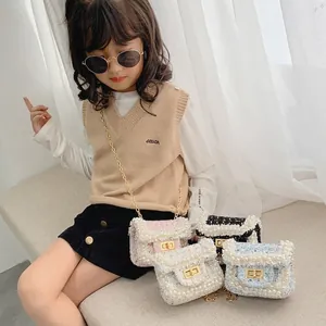 Girl wearing quilted tweed shoulder bag with pearl trim and gold chain strap in four colors