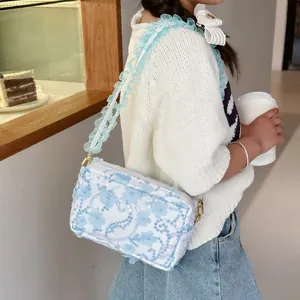 Floral crossbody bag for girls with lace flower embroidery and ruffled shoulder strap