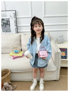 Pink metallic crocodile pattern bag styled with a child's trendy fashion outfit