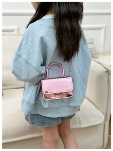 Pink crocodile pattern mini bag with metallic pearl chain strap and flip cover detail